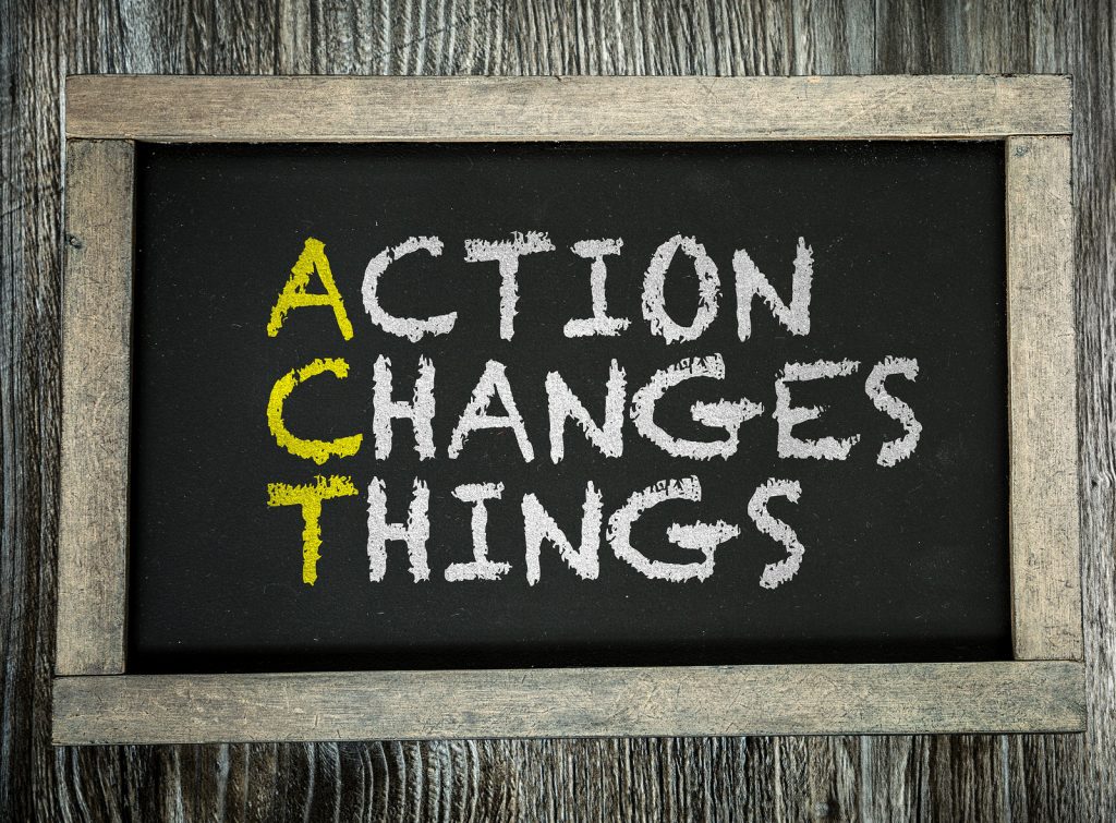 Action Changes Things written on chalkboard